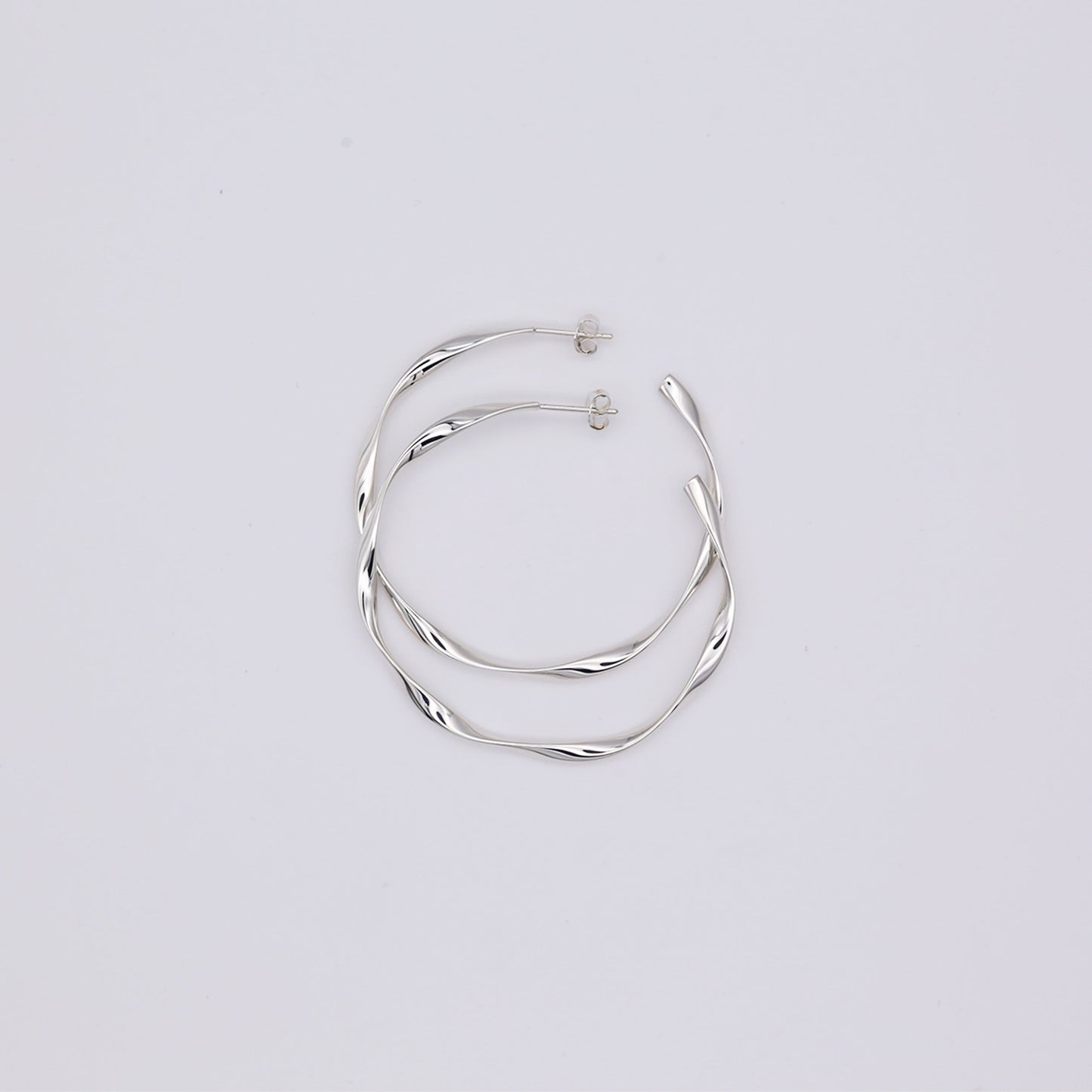 Large twisted hoop earrings, sterling silver, high polish finish