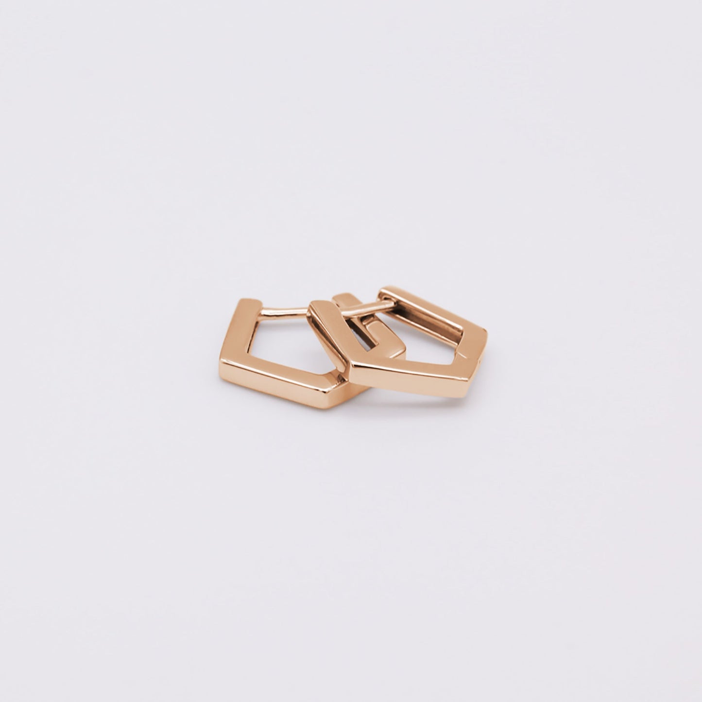 Rose gold vermeil pentagon huggies earrings